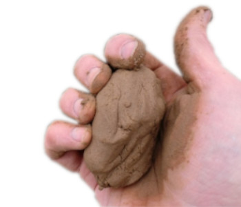 brown clay in hand