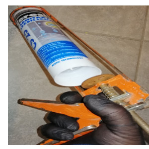 fitting silicone sealant onto a orange gun