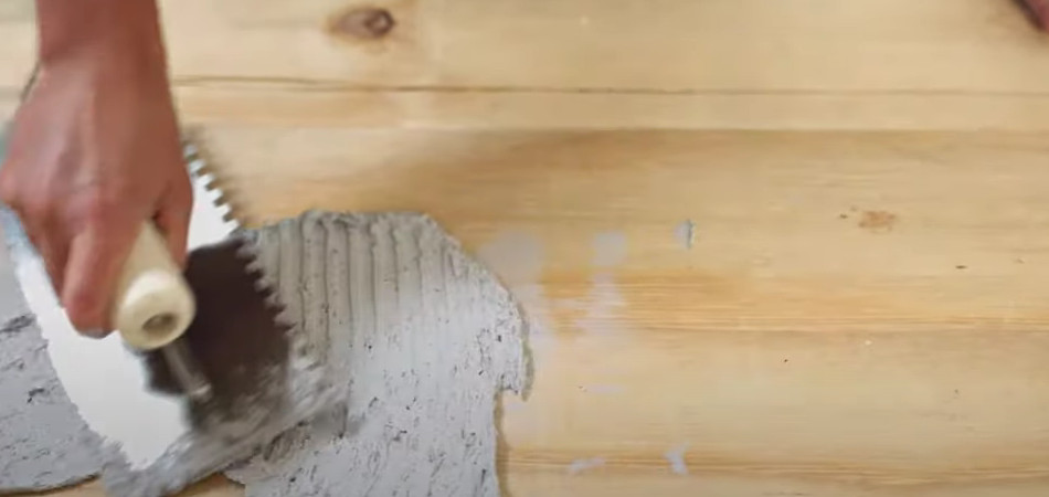 gluing cement board to plywood floor