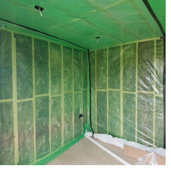 green vcl foil on a timber framed wall