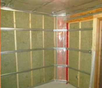 green mineral wool installed inside shed
